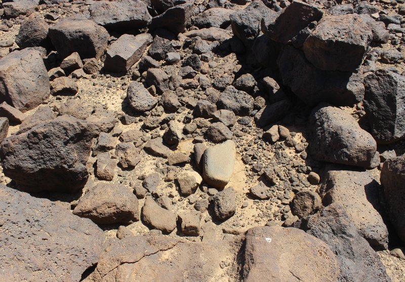 Khirbet al-Jabariya dwelling prior to excavation with grinding stone fragments on the surface